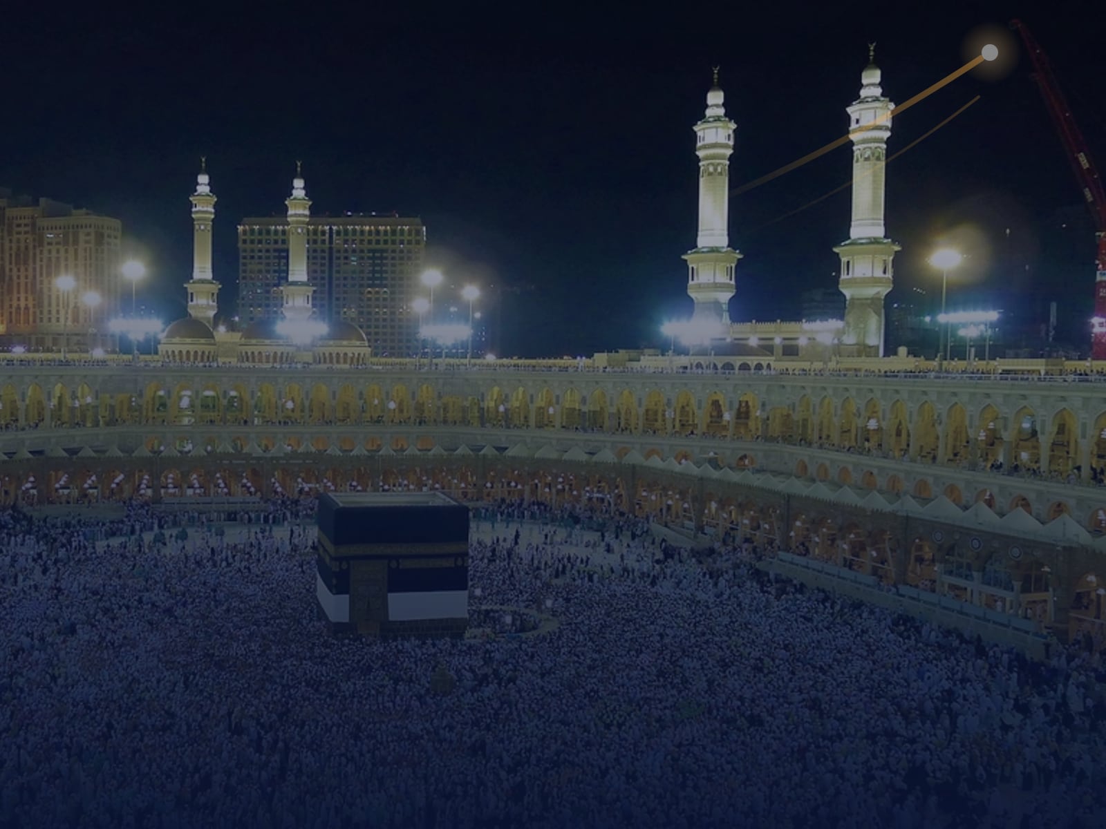 The Kaaba and Masjid al-Haram in Makkah at night, where pilgrims stay online with a Saudi Arabia eSIM